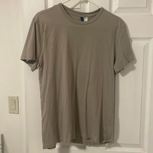 Divided size medium beige t shirt